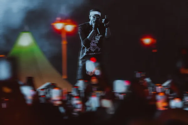 Rage under the July night sky. Travis Scott headlined day two of Rolling Loud Europe at Magna Racino near Vienna. Photographers were not allowed into the pit for his set, so every frame here was shot from further back, over a sea of phone lights.