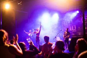 Ines Erbus performing with band at local student party.