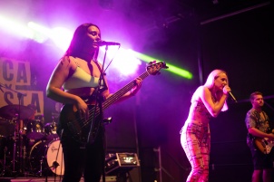 Ines Erbus performing with band at local student party.